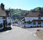 The village nestles on the slopes of a diverse, beautiful valley, rich in meadow, pasture land and wooded cleaves
